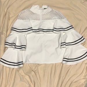 Have fun in this bell sleeved blouse!